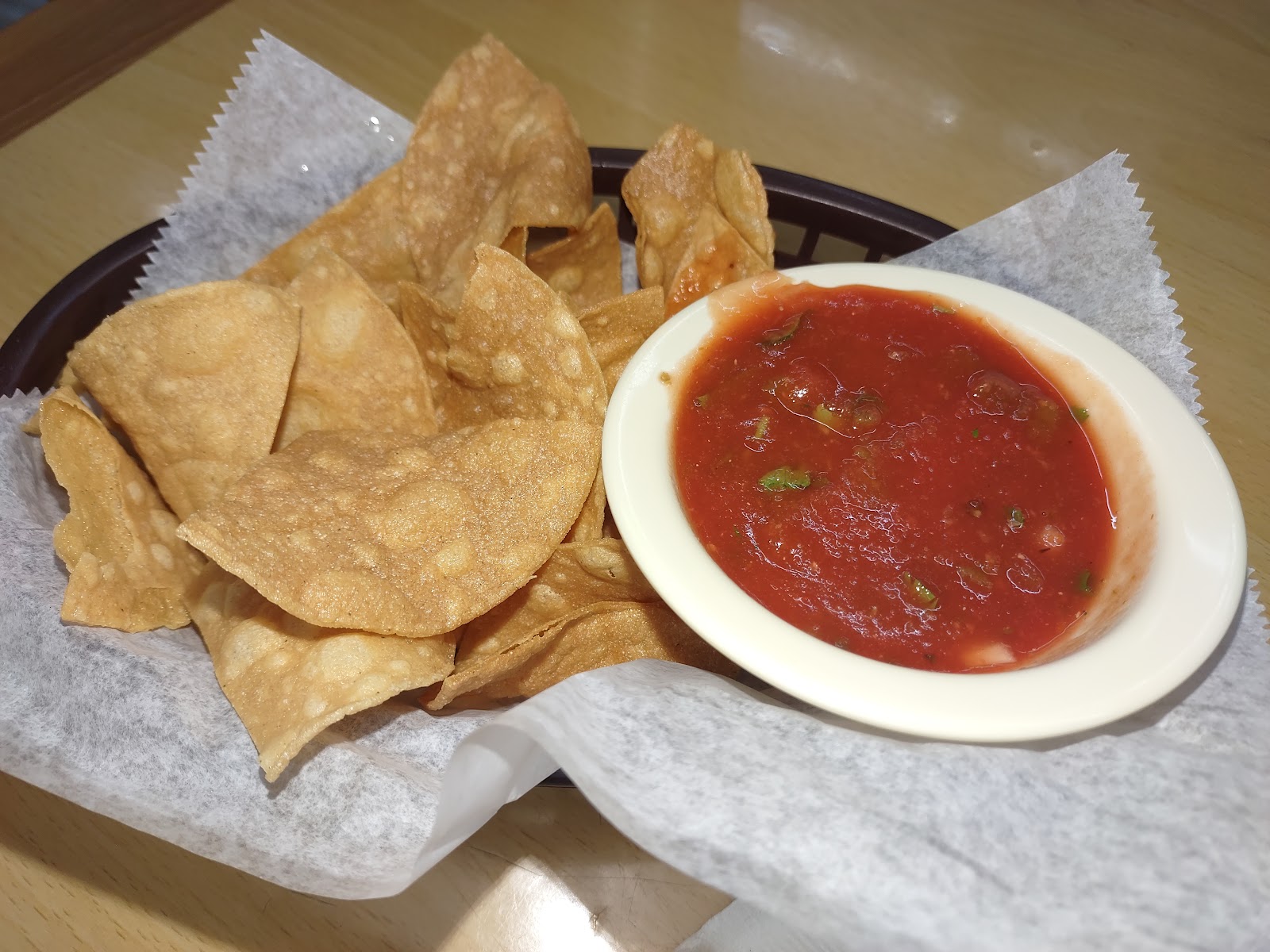 Basket of fresh chips with house salsa